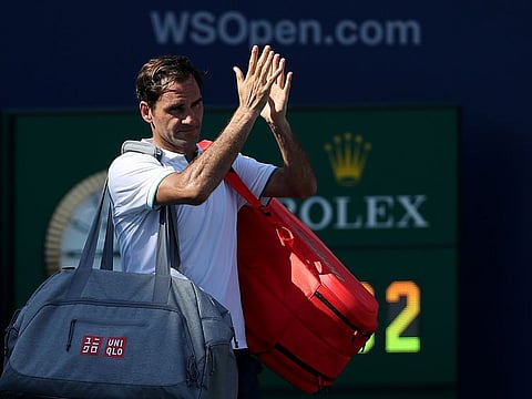 Roger Federer acknowledges the crowd after losing in straight sets to Andrey Rublev.