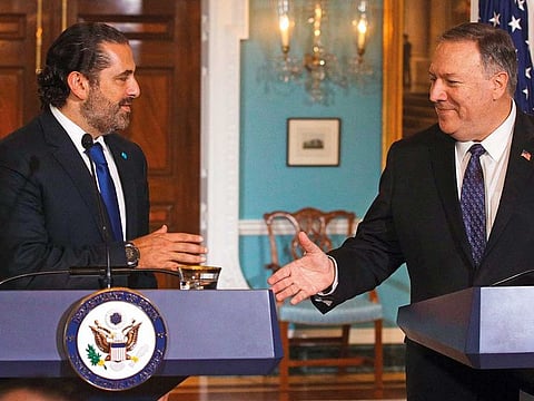 U.S. Secretary of State Mike Pompeo shakes hands with Lebanese Prime Minister Saad Hariri after they spoke to members of the media at the State Department August 15, 2019 in Washington, DC.