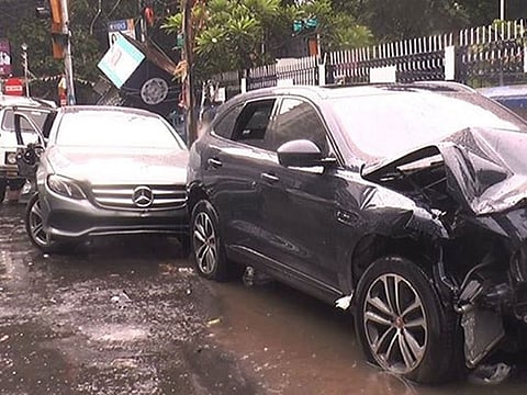Jaguar and Mercedes sedan at the scene of the accident.