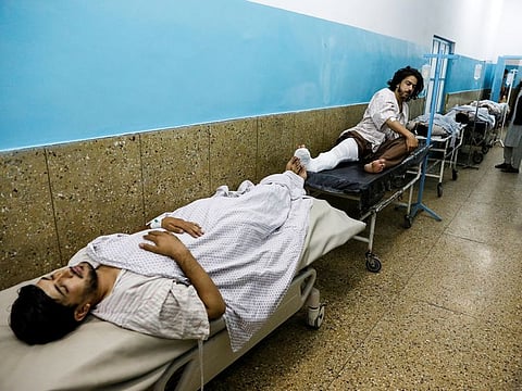 Injured men receive treatment in the hospital after sustaining wounds from a blast at a wedding hall in Kabul, Afghanistan August 18, 2019