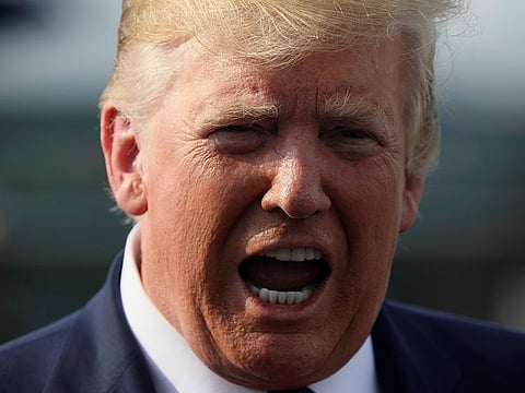 U.S. President Donald Trump speaks to reporters before boarding Air Force One to return to Washington from Morristown Municipal Airport in Morristown, New Jersey U.S. August 18, 2019.