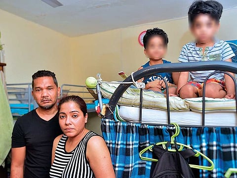 Mohammad Fehrat Abbas with his wife and two sons. The family wants to fly back home. However, outstanding payments prevent their exit.