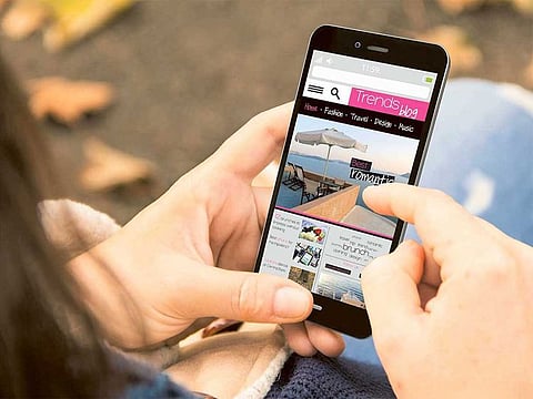 A mobile phone user browses the Internet.