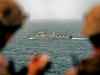 File picture: US Navy keep watch on Iranian fast attack craft in the Strait of Hormuz.