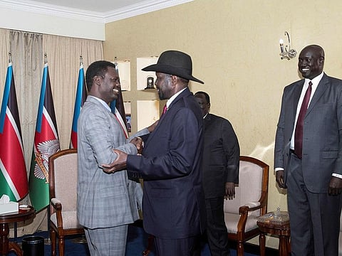 Leader of the Sudan Liberation Moment/Army (SLM/A) in Darfur Minni Arko Minnawi (L) is greeted by South Sudan's President Salva Kiir (R) during their meeting at the state House in Juba on August 20, 2019.