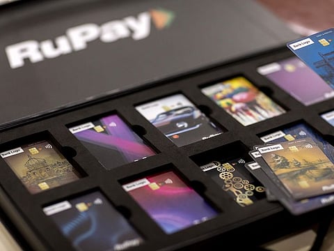 File photo: Mock-ups of RuPay Cards are displayed for a photograph at the office of National Payments Corporate of India (NPCI) in Mumbai.
