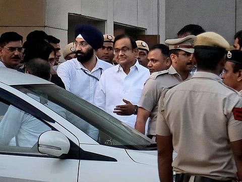 Palaniappan Chidambaram, center, comes out from a special court in New Delhi, India, Thursday, August 22, 2019.