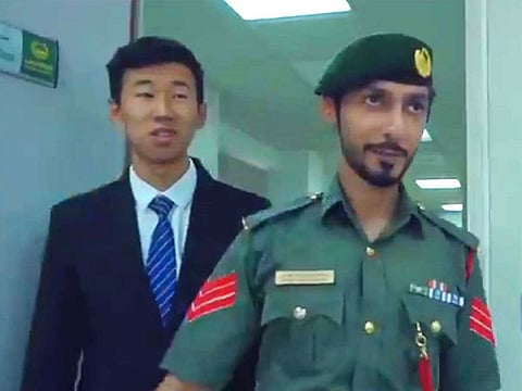 Chinese student Zayan who is studying Arabic language at the University of Sharjah, is spending time with Dubai police to improve his skills.