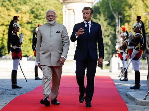 French President Emmanuel Macron, right, welcomes Indian Prime Minister Narendra Modi before a meeting at the Chateau of Chantilly, north of Paris, Thursday Aug. 22, 2019.
