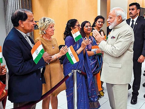 PM Narendra Modi being welcomed by the Indian community at Charles de Gaulle Airport in Paris, France.
