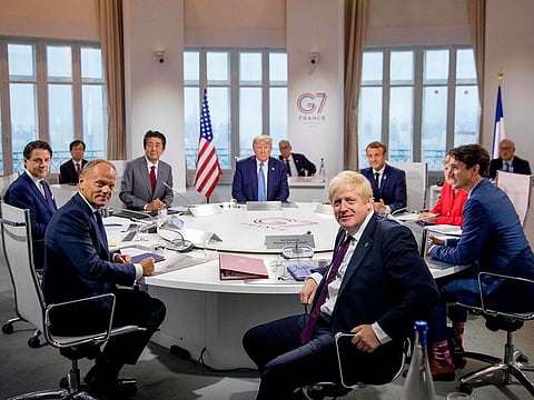 Left to right: Italy's Prime Minister Giuseppe Conte, European Council President Donald Tusk, Japan's Prime Minister Shinzo Abe, US President Donald Trump, Britain's Prime Minister Boris Johnson, France's President Emmanuel Macron, Germany's Chancellor Angela Merkel and Canada's Prime Minister Justin Trudeau.