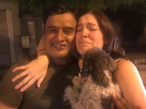 Pakistani worker Abid Yasin (left) found Buddy the missing dog and reunited him with his British owner Lisa Sykes (right)