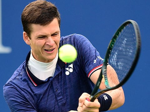 Hubert Hurkacz of Poland returns a shot from Benoit Paire of France during the men's singles championship final of the Winston-Salem Open at Wake Forest University on August 24, 2019 in Winston Salem, North Carolina.