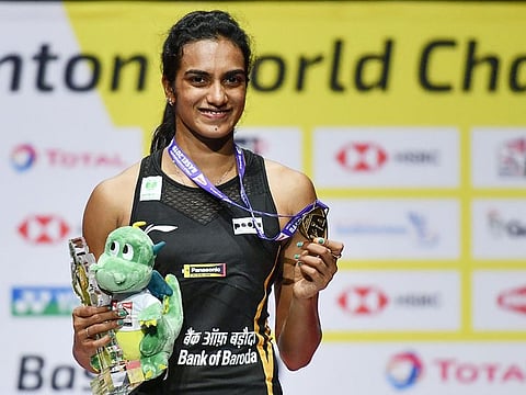 P.V. Sindhu poses with the gold medal during the podium cermony after her victory at the World Championship.
