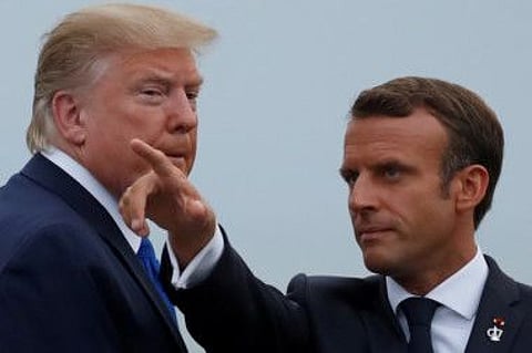 French President Emmanuel Macron welcomes U.S. President Donald Trump at the G7 summit in Biarritz, France, August 24, 2019.