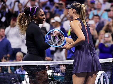 Serena Williams (left) shakes hands with Maria Sharapova after their first-round match at the US Open last year. Patrick Mouratoglou, Serena's long-time coach, fears that the grand slam should not turn into a US national championship due to players pulling out for quarantine procedure.