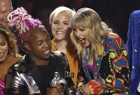 Taylor Swift, right, accepts the video for good award for "You Need to Calm Down" at the MTV Video Music Awards at the Prudential Center on Monday, Aug. 26, 2019, in Newark, N.J. (Photo by Matt Sayles/Invision/AP)