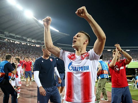 Red Star Belgrade's Marko Gobeljic celebrates after the match.