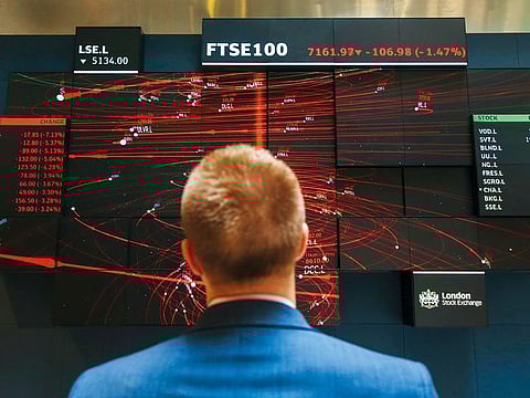 File picture of the share index board in the atrium of the London Stock Exchange. Gulf businesses will need to give serious rethink about future listings on the bourse.