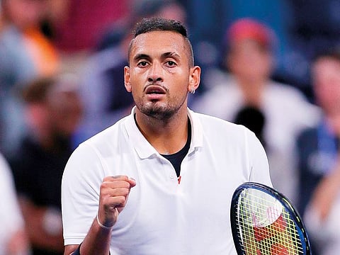 Nick Kyrgios of Australia calmed himself down to topple world No. 6 Stefanos Tsitsipas 5-7 6-2 6-4 at the Halle Open on Wednesday.