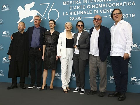 Jury members Shinya Tsukamoto, from left, Piers Handling, Stacy Martin, Mary Harron, Jury President Lucrecia Martel, Paolo Virzì and Rodrigo Prieto pose for photographers at the photo call for the jury at the 76th edition of the Venice Film Festival in Venice, Italy, Wednesday, Aug. 28, 2019. (Photo by Joel C Ryan/Invision/AP)