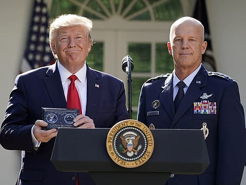 US President Donald Trump stands with General John Raymond, incoming US Space Command commander.