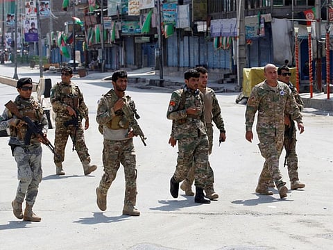 Afghan security forces arrive at the site of a blast in Jalalabad, Afghanistan.