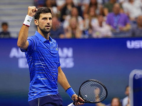 Novak Djokovic of Serbia reacts after winning a point against Denis Kudla of the United States