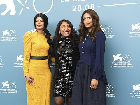 Actress Dhay, from left, director Haifaa Al Mansour, and actress Khalid Abdulrhim poses for photographers at the photo call for the film 'The Perfect Candidate' at the 76th edition of the Venice Film Festival in Venice, Italy, Thursday, Aug. 29, 2019. (Photo by Arthur Mola/Invision/AP)