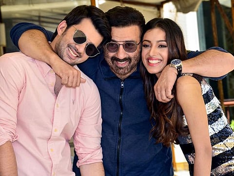 Mumbai: Bollywood actor and MP Sunny Deol with actors Karan Deol and Sahher Bambba pose for photographs during promotion of their upcoming film 'Pal Pal Dil Ke Paas' in Mumbai, Friday, Aug 23, 2019. (PTI Photo)(PTI8_23_2019_000152B)