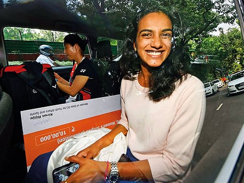 World champion P.V. Sindhu after meeting Indian Sports Minister Kiren Rijiju at the latter’s residence in New Delhi last Tuesday. Sindhu became the first Indian to win the badminton World Championships in Basel last Sunday.