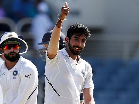 India's Jasprit Bumrah celebrates his hat-trick wicket with the dismissal of West Indies' Roston Chase.