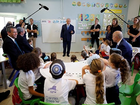Israeli Prime Minister Benjamin Netanyahu speaks to students during a ceremony opening the school year in the Jewish colony of Elkana in the Israeli-occupied West Bank September 1, 2019.