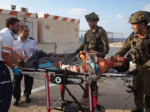 Israeli regime paramedics and soldiers evacuate an allegedly mock wounded comrade at a helipad in Ramban hospital in Haifa on Sunday as part of a deception operation of the Israeli occupation army in order to mislead the leadership of Hezbollah.