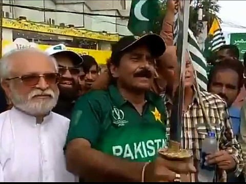 Pakistani cricketer Javed Miandad carrying sword to show solidarity with Kashmiris in a recent rally.