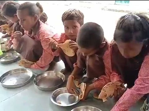 In the video from the Mirzapur school, children were seen sitting on the floor and eating rotis with salt.