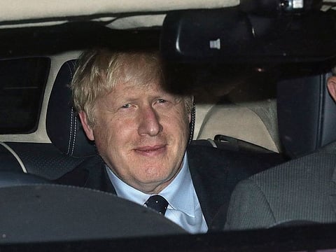Prime Minister Boris Johnson leaves the House of Commons in London, Tuesday, Sept. 3, 2019, after MPs voted in favor of allowing a cross-party alliance to take control of the Commons agenda on Wednesday in a bid to block a no-deal Brexit on October 31.