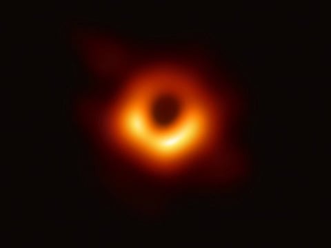 A handout photo provided by the European Southern Observatory on April 10, 2019 shows the first photograph of a black hole and its fiery halo, released by Event Horizon Telescope astronomers (EHT), which is the "most direct proof of their existence," one of the project's lead scientists told AFP.