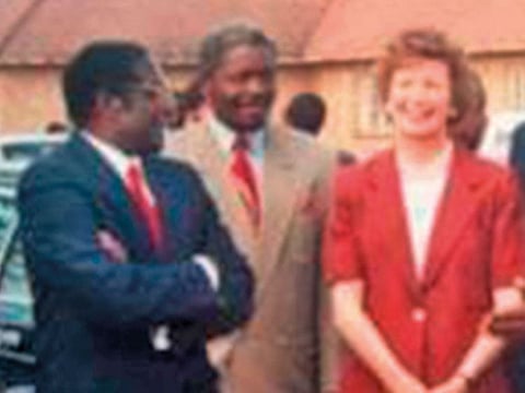 Mugabe (left) with Mary Robinson.