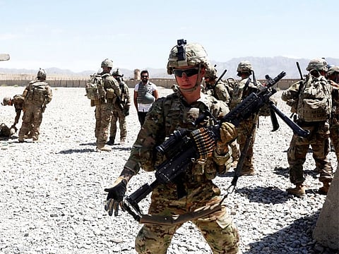 US troops wait for their helicopter flight at an Afghan National Army (ANA) Base in Logar province, Afghanistan, last year
