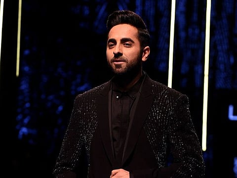 Indian Bollywood actor Ayushmann Khurrana presents a creation by the designer brand Rohit Gandhi and Rahul Khanna at Lakmé Fashion Week (LFW) Winter Festive 2019 in Mumbai on August 24, 2019. / AFP / Sujit Jaiswal