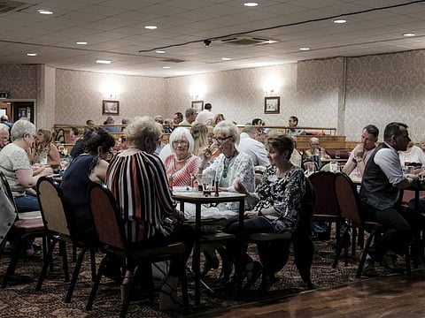 A night of bingo, drinking and dancing at Ye Olde Durham Social Club in Hartlepool, England, July 12, 2019. For the first time in modern history, Britons are living shorter lives, with poor lifestyles, depression and budget cuts the leading causes. (Mary Turner/The New York Times)