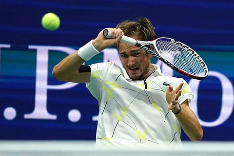 Daniil Medvedev of Russia returns against Grigor Dimitrov of Bulgaria en route to his win in the men's singles semi-finals on Friday.