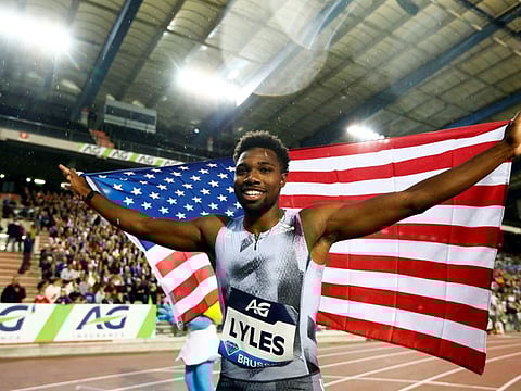 Noah Lyles of the US celebrates with the national flag after winning the men's 200 metres at Golden League in Brussels on Friday.