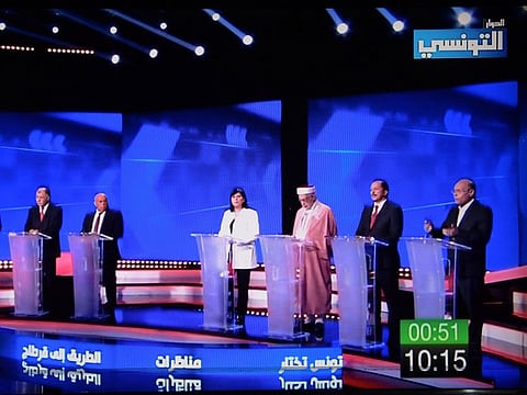 This tv grab taken from Ettounsiya TV shows candidates attending a TV debate for presidential candidates