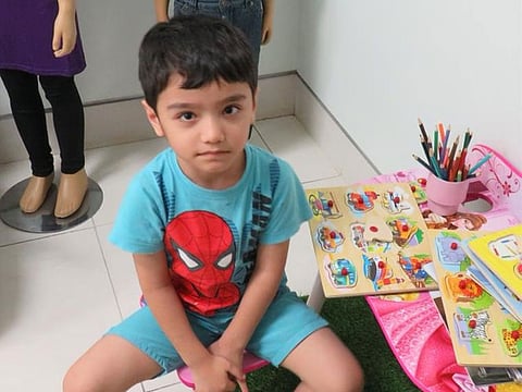 This boy was found wandering alone at Al Reef Mall in Deira, Dubai searching for his parents.