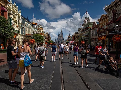 Guests walk through Disney World.