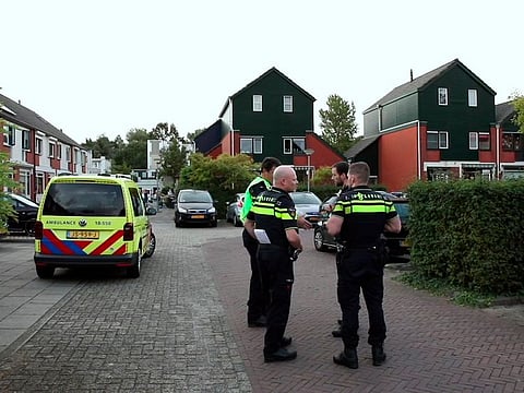 Police officers are seen at the scene of a shooting in Dordrecht, Netherlands, Monday, Sept. 9, 2019.
