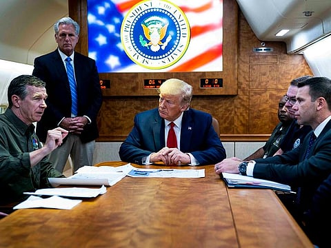 Former President Donald Trump with, from left, North Carolina Gov. Roy Cooper, newly-elected House Majority Leader Kevin McCarthy (R-Calif.) and others.