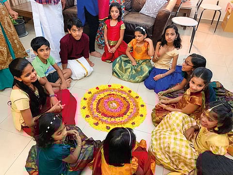 Malayali children in Dubai form a Pookalam (floral design on the floor) as part of Onam celebrations.